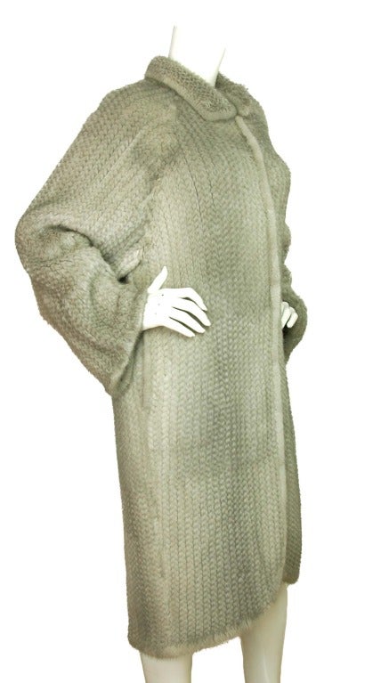 CHRISTIAN DIOR Grey Crochet Mink Coat Sz. 10
Made in China
Materials: 100% mink
Features collared chevron-pattern mink coat. Long sleeves, slip pockets at sides.Hook and eye closures down the center.
Marked size: US 10
Shoulder: 16
