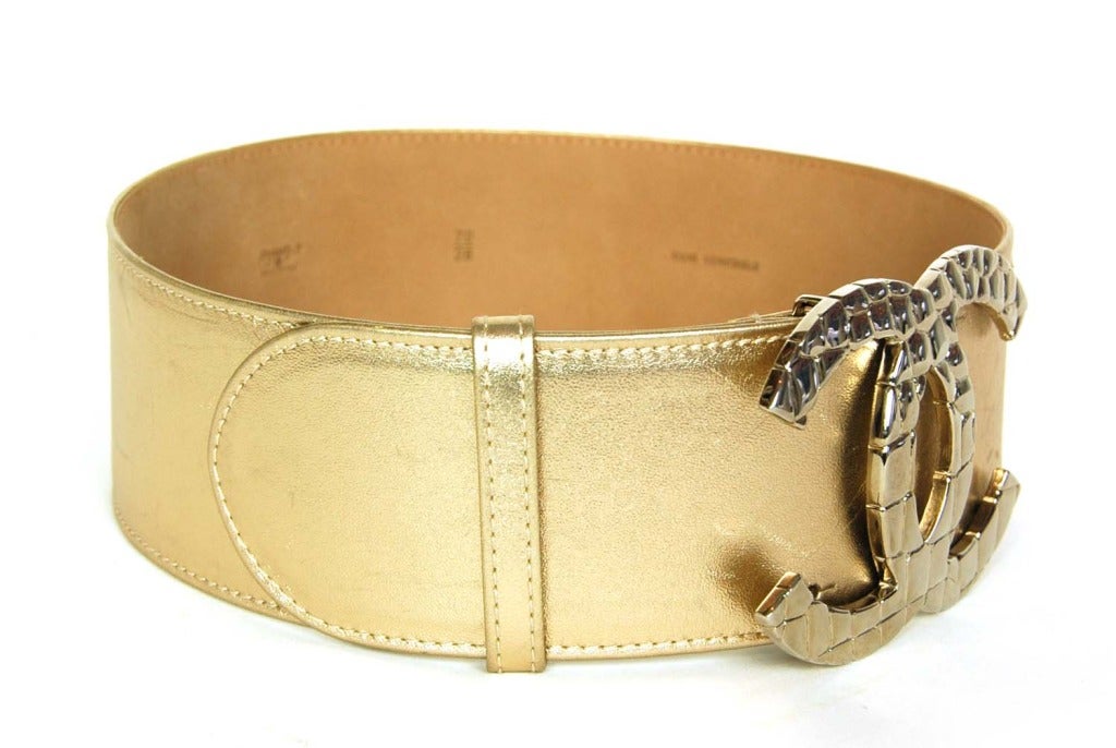 Chanel Gold Metallic Leather Belt With Goldtone CC Buckle

Made in Italy
Materials: leather, goldtone hardware
Features five holes for proper adjustment
Stamped 