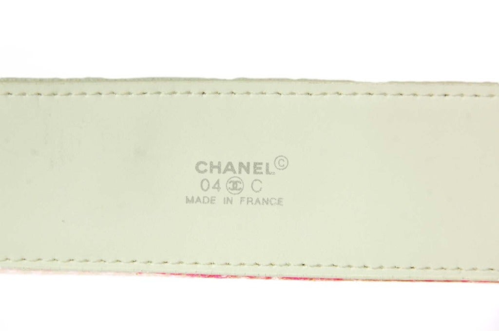 Chanel Pink & Yellow Coco Chanel Terrycloth Belt 
Features Camelia belt buckle
Made In: France
Year of Production: 2004
Color: Pink, yellow, and white
Hardware: Enamel
Materials: Leather, terrycloth and enamel
Closure/Opening: Sliding  belt