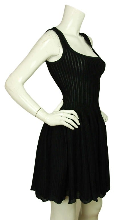 ALAIA Black Sleeveless Pleated Stretchy Dress With Scalloped Edge Sz. 36
Made in Italy 
Bodycon bodice with flare skirt
60% viscose, 15% silk, 15% polyester, 10% nylon.
Features scoop neck dress with pleats and flared skirt with scalloped edge.