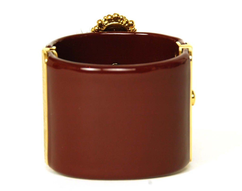 CHANEL 2013 Burgundy Resin Clamper Cuff Bracelet W. Logo Feather Medallion In Excellent Condition In New York, NY