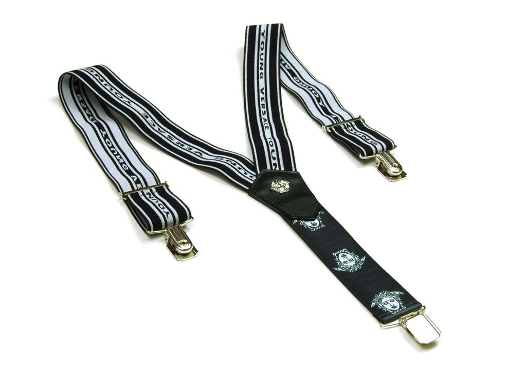 VERSACE Black & White 'Young Versace' & Medusa Head Suspenders Sz. L
Materials: elastic, silver metal, black leather.
Features black and white striped suspenders with 