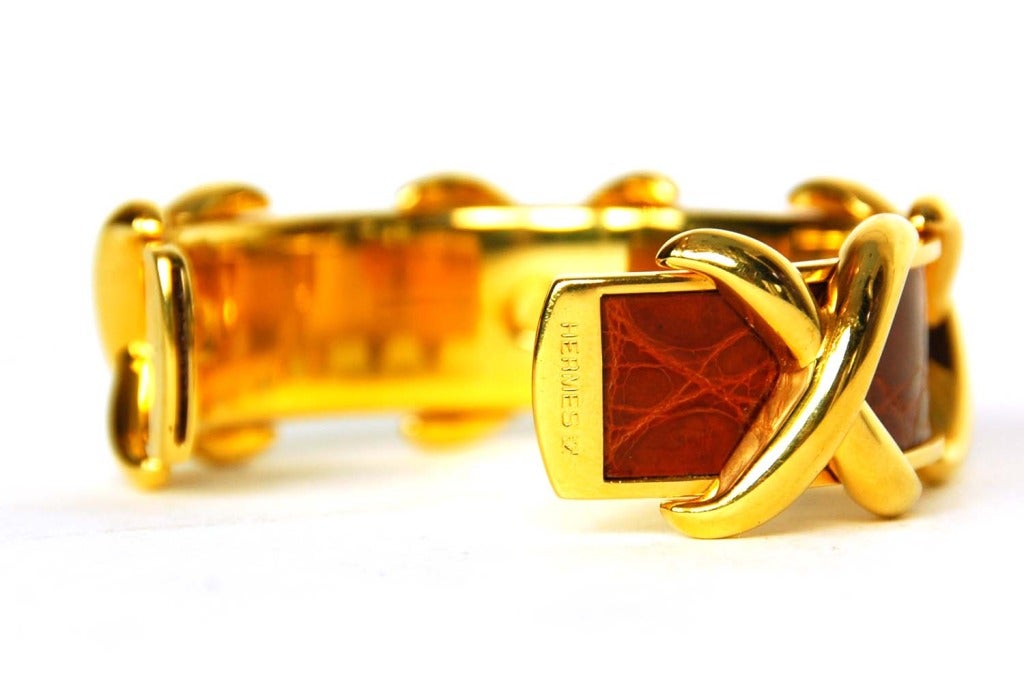 HERMES Goldtone Cuff Bracelet W. Red Crocodile Skin & Gold X's In Excellent Condition In New York, NY