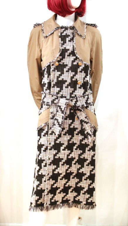 This Chanel Tweed Coat is the perfect must-have for the up and coming fall/winter season.<br />
<br />
Features black/white tweed houndstooth body with tan cotton upper, sleeves and trimmed pocket flaps. It closes with four CHANEL CC button