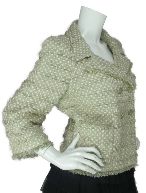 Chanel Green Double Breasted Jacket W/White Polka Dot Overlay 

Made in France
Composition: 45% rayon, 25% cotton, 23% nylon, 7% wool
White polka dot organza ribbon overlay
Four green buttons with logo CC in center
Two front pockets
Fringe