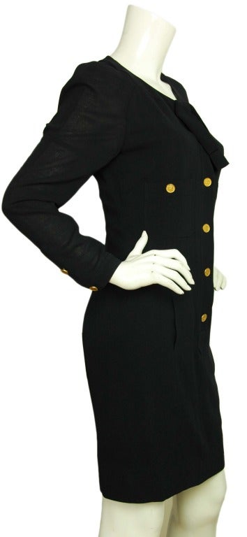 Chanel Navy Crepe Longsleeve Dress - Sz 2

Composition tag removed
Features five Coco Chanel buttons on front of dress with bow and three snap closures
Two front pockets with a Coco Chanel button closing each
Labeled 