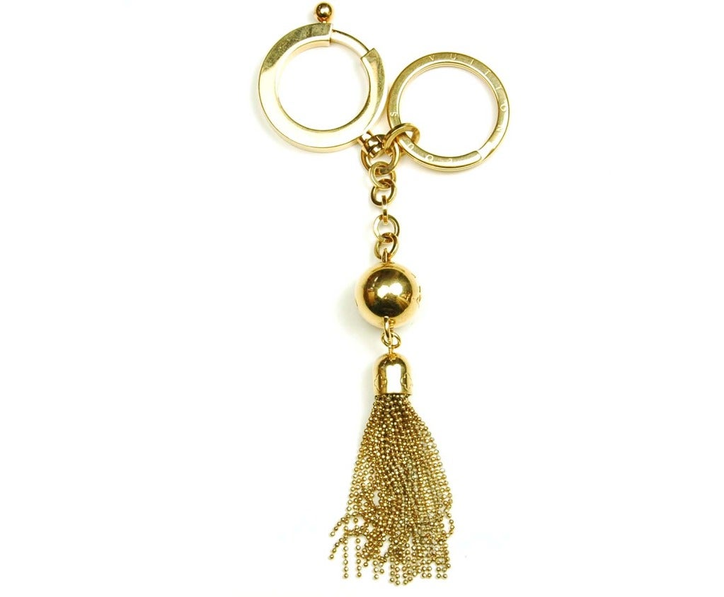 LOUIS VUITTON Goldtone Logo Tasseled Key Ring/Bag Charm RT. $475