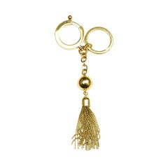 LOUIS VUITTON Goldtone Logo Tasseled Key Ring/Bag Charm RT. $475