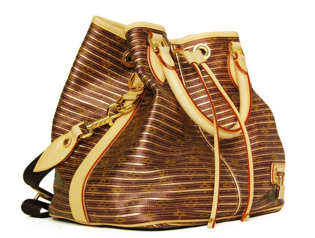 LOUIS VUITTON Brown Monogram Striped 'Eden Neo Peche' Drawstring Bag RT. $2.880 c. 2010
Age: 2010
Made in France
Materials: coated canvas, leather, nylon strap, goldtone hardware, beige alcantara lining.
Features drawstring bucket bag in