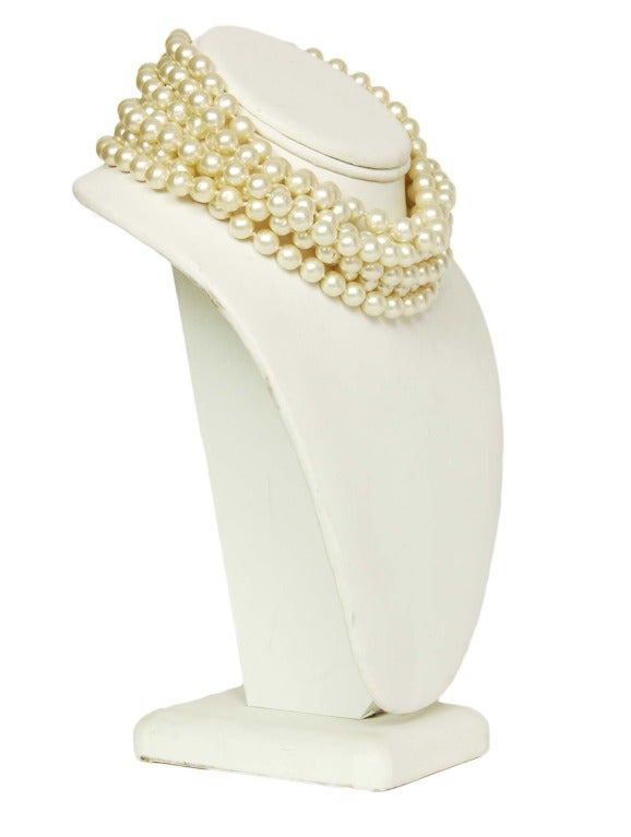Chanel Seven-Strand Pearl Choker

Age: c. 1970-1980's
Made in France
Material: faux pearls, goldtone metal
Hook closure
Stamped 