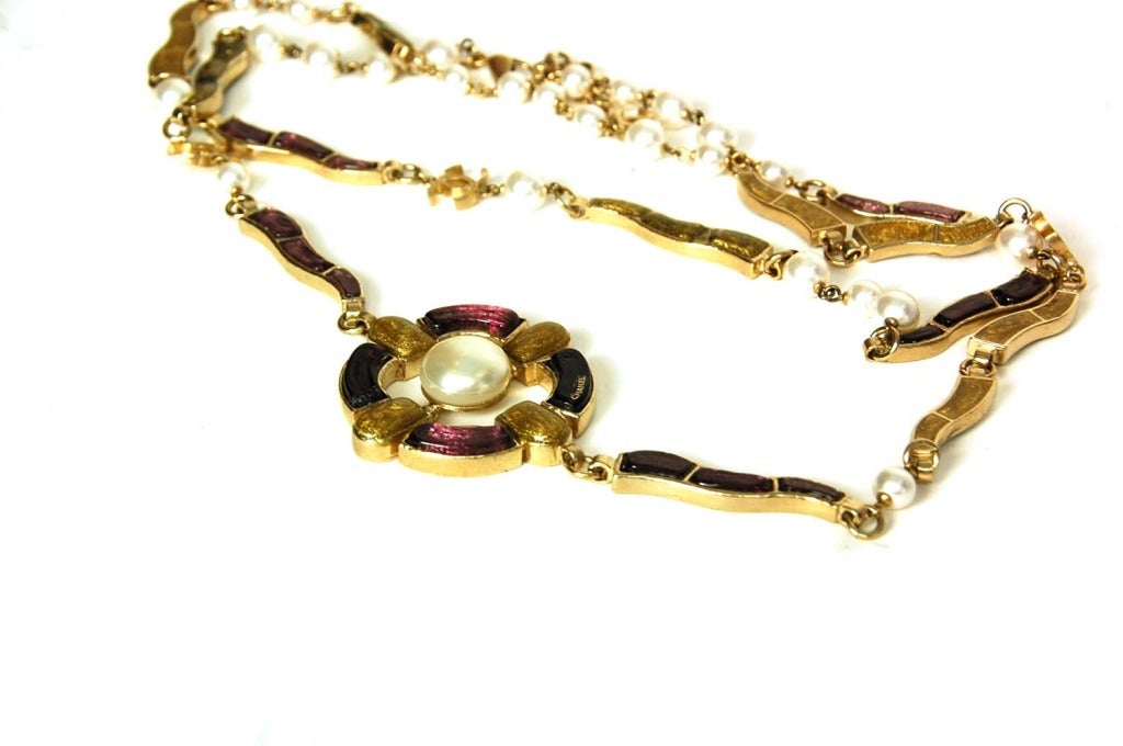 Chanel Multi-Colored Gripoix & Pearl Necklace/Belt 
Features goldtone CC pendants throughout as wel as one large pendant

Made In: France
Year of Production: 2007
Color: Ivory, mauve/purple, olive green and pale goldtone
Materials: Metal, poured