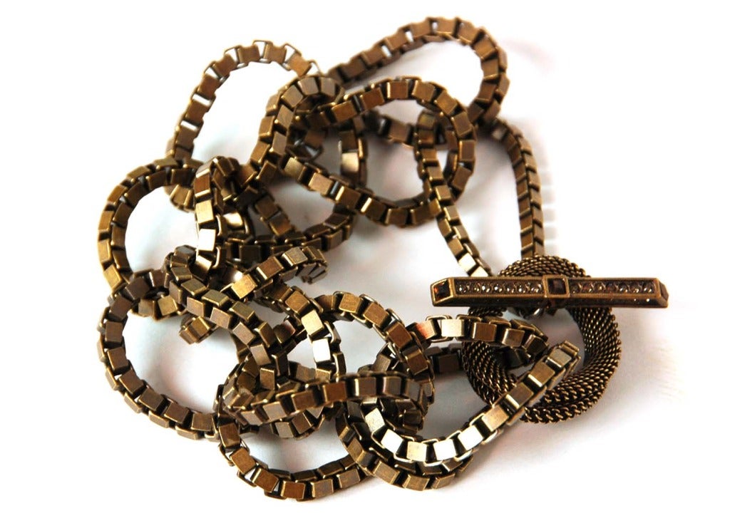 LANVIN Brasstone Chunky Link Bracelet
Made in France
Features 6 brasstone links with mesh link lop at end.
Toggle closure adorned with gold rhinestones.
Toggle is stamped LANVIN PARIS MADE IN FRANCE
Hand made.
9