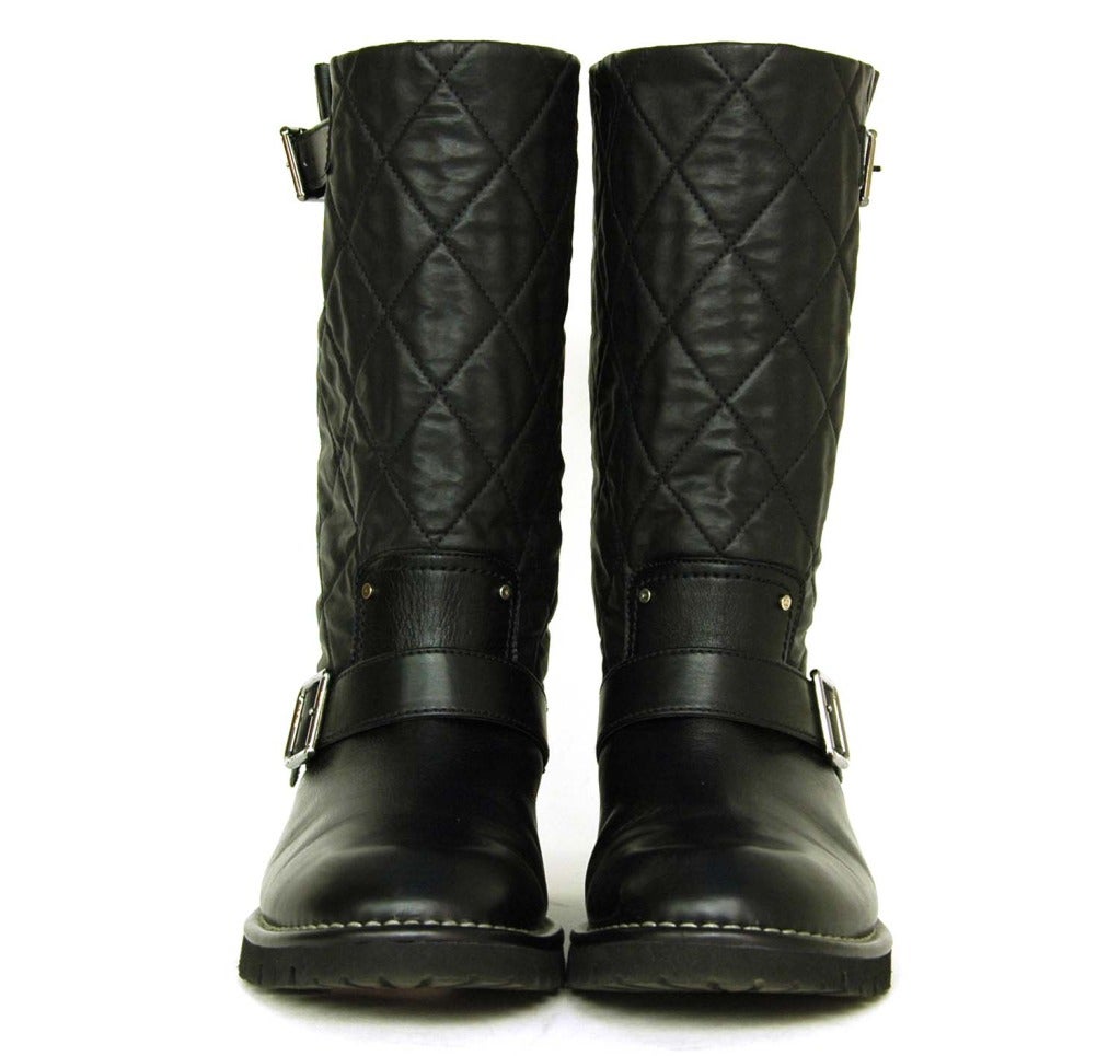 Chanel Black Quilted Short Boots With Shearling Lining - Sz. 9.5

Age: c. 2011
Made in Italy
Materials: leather, silvertone metal, shearling, rubber sole
Adjustable strap around front ankle with buckle closure 
Short adjustable strap at top of