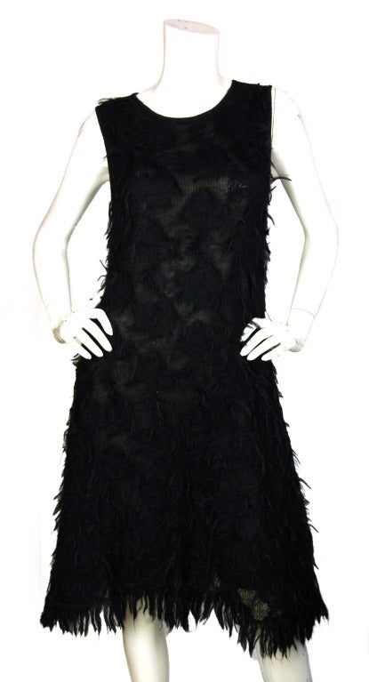 Chanel Black Mohair Sleeveless Dress

Age: 2009
Made In France
Materials: 65% Mohair, 35% Nylon with 94% Silk and 6% Spandex Lining
Marked Size: 40

US Size: 8 - Bust: 34