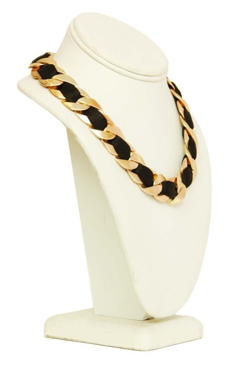 Chanel Goldtone And Satin Ribbon Choker

    Age: c. 2010
    Made in France
    Materials: goldtone metal, satin ribbon
    Closes with lobster claw lock on CC charm
    Stamped 