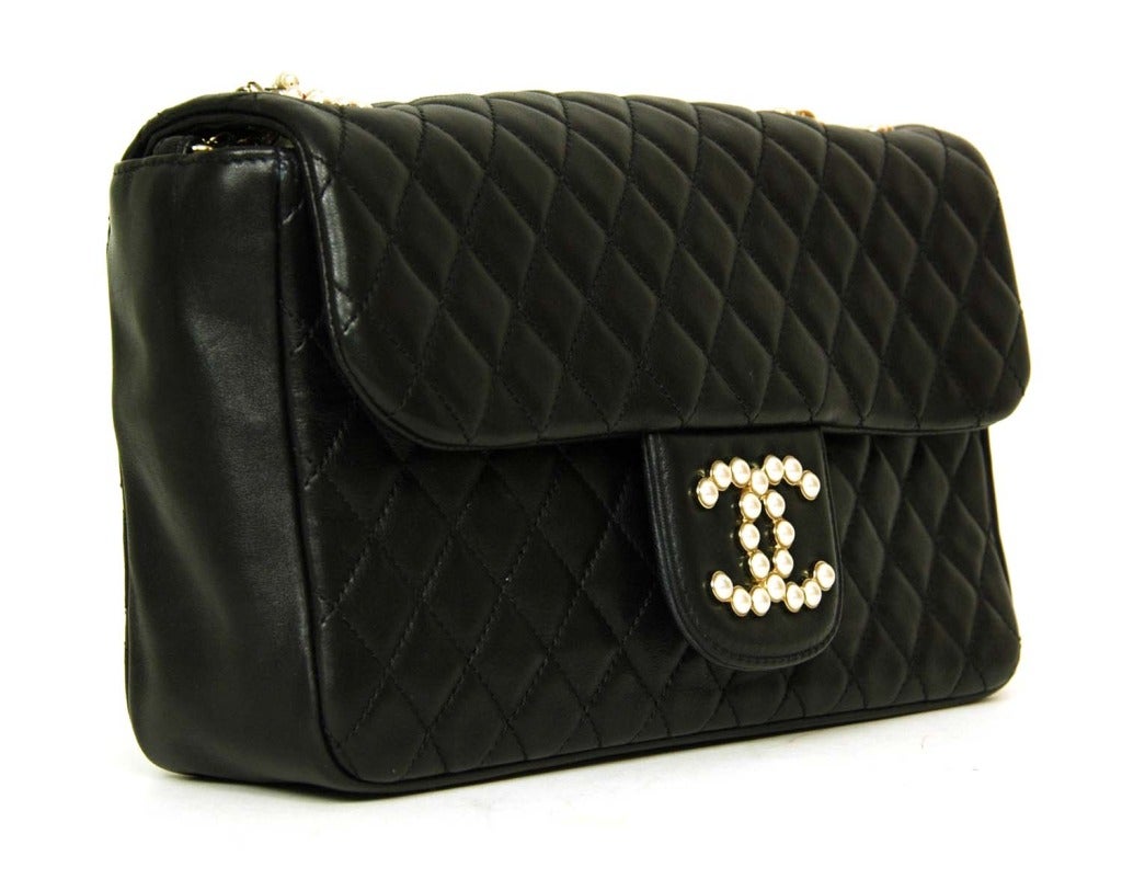 Chanel black quilted leather bag

Age: 2011
Made in Italy
Materials: lambskin
Features faux pearl CC on front
5 strand strap made of chains, leather and faux pearls
Stamped: CHANEL PARIS MADE IN ITALY
Hologram sticker reads: