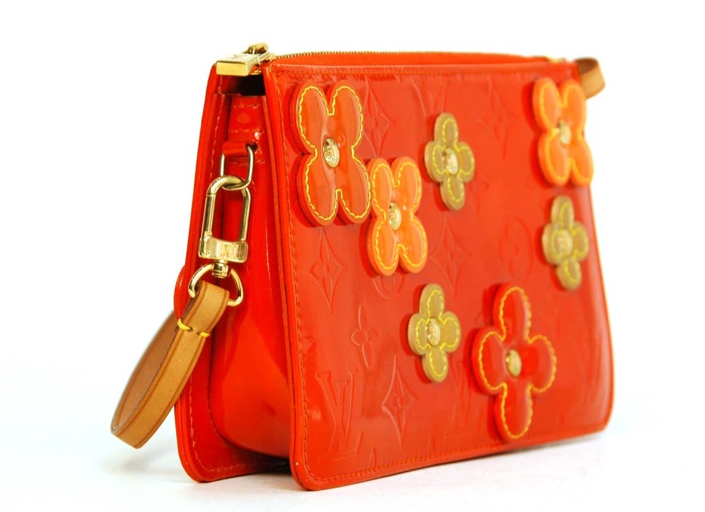 Louis Vuitton Orange LEXINGTON FLEUR Pochette

    Age: c. 2002
    Made in France
    Materials: patent leather, goldtone metal
    Flowers on each side of pochette
    Top zipper closure
    Date stamp reads VI0092
    Stamped 
