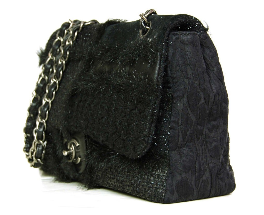 c.2010-2011
Made in Italy
Body is a patchwork of various black tweeds with a black faux fur trim
Brushed silvertone hardware.
Leather laced chain shoulder strap which can be singled or doubled.
Signature CC twist lock closure.
Black textile