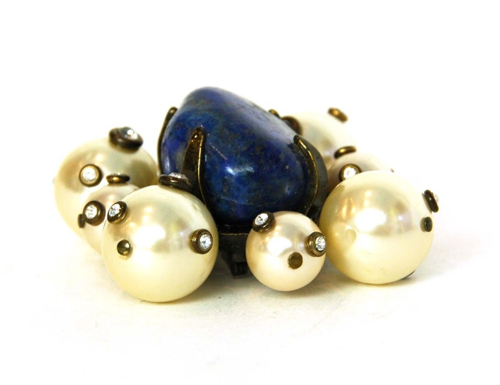 Chanel Faux Pearl And Rhinestone Pin W/Blue Stone

    Age: c. 1997
    Made in France
    Materials: faux pearls, rhinestones blue stone
    Stamped 