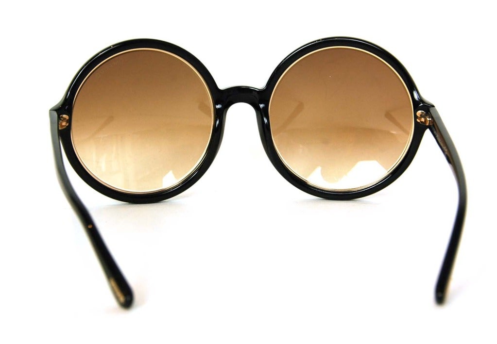 black sunglasses with gold trim
