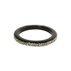 CHANEL Black Resin Bangle With Etched Camelia Border