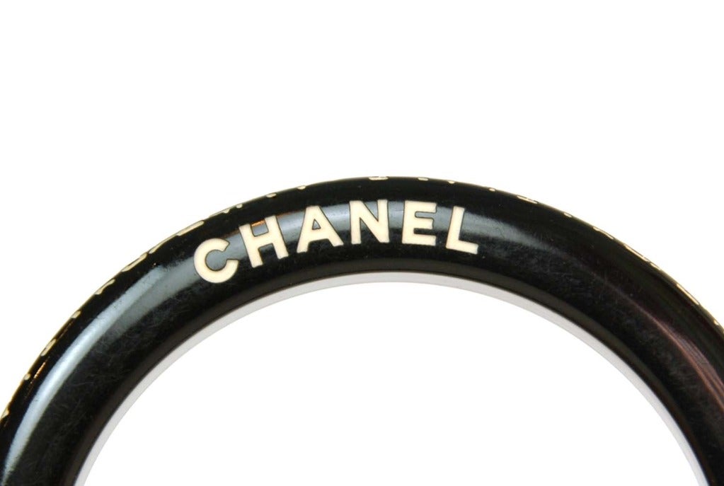 Chanel Black Resin Bangle With Etched Camelia Border

    Age: c. 2006
    Made in Italy
    Materials: resin
    Stamped 