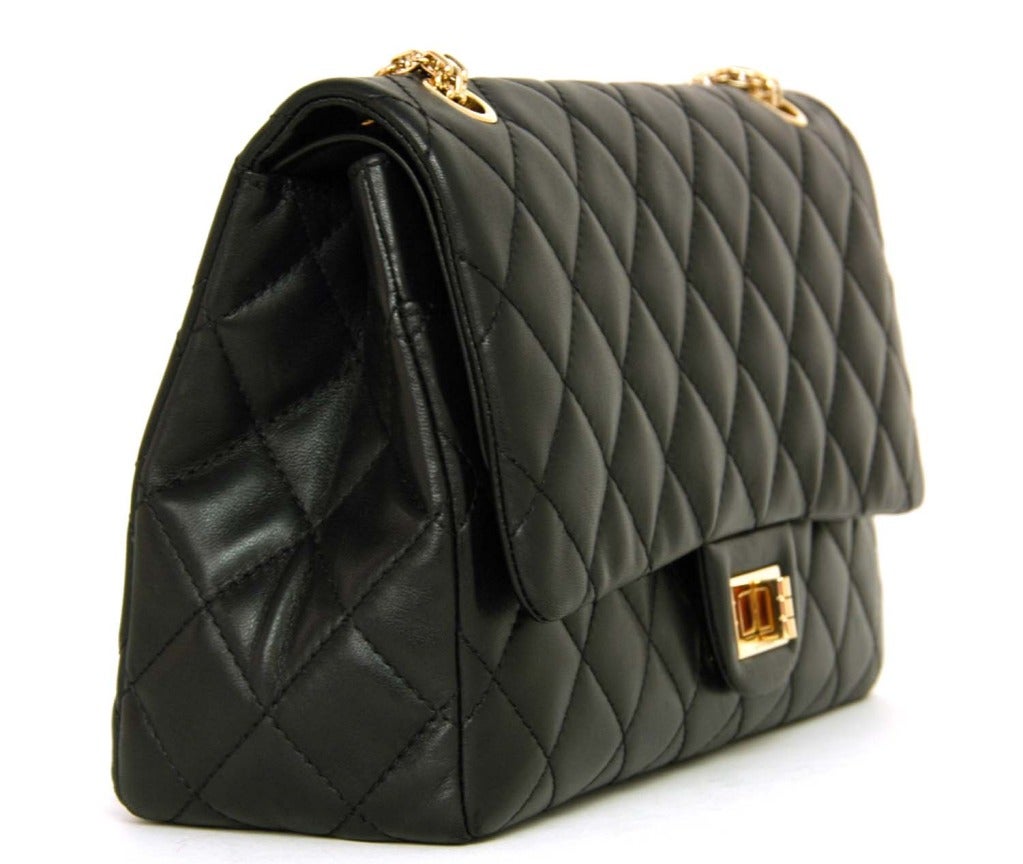 Age: c. 2009
Made In France
Features Classic Quilted Black Lambskin. Thick Gold Chain Strap, Gold Reissue Turnlock Closure. Double Flap With Snap Lock Button. Fabric Interior. Two Exterior Slit Pockets, Two Interior Slit Pockets. Top Flap Has