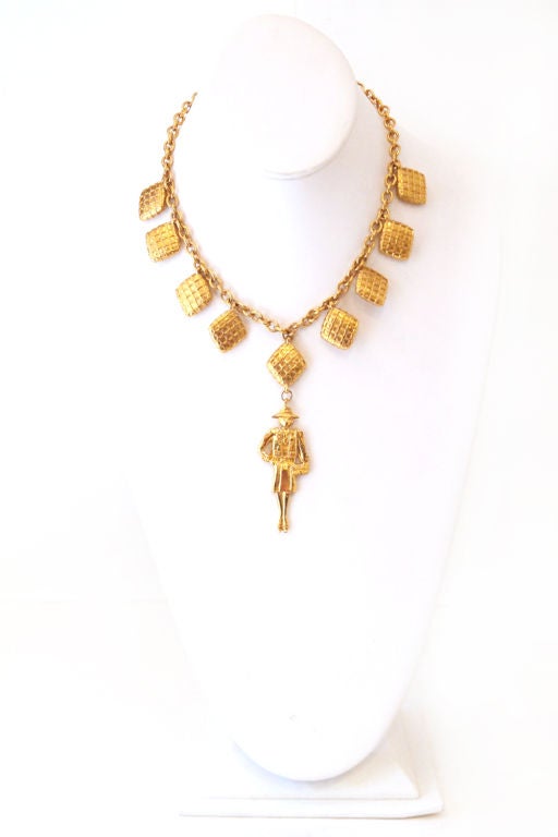 So rare & stunning, this fabulous vintage CHANEL necklace is a must have addition to any Chanel lover's collection!<br />
<br />
Features nine quilted diamond shape charms around, with a coco chanel golden metal charms hangs on the center. Hook