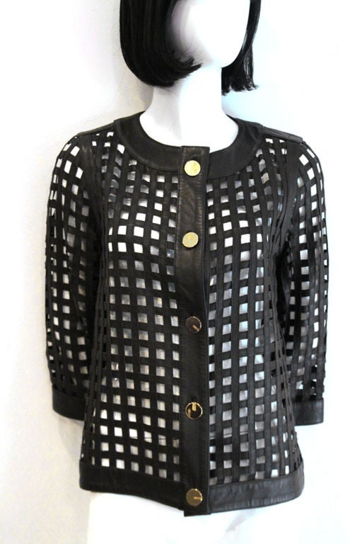 This ESCADA leather button-up jacket would make a perfect addition to any wardrobe.<br />
<br />
Features basket woven lamb napppa in brown. The jacket closes with five golden hardware front button closure. Size 32, please refer to our approximate