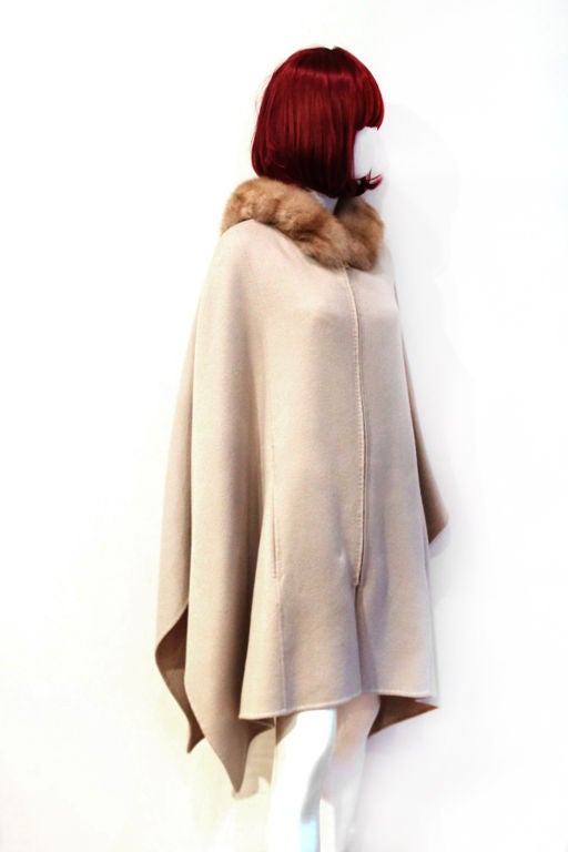 This LORO PIANA Grey Cashmere Cape w/ Sable Fur Hood is the perfect must-have for the season! <br />
<br />
The cape is made of 100% cashmere.  Features sable fur hood and an optional leather belt. Two exterior front pockets. Retail was $8,700 +
