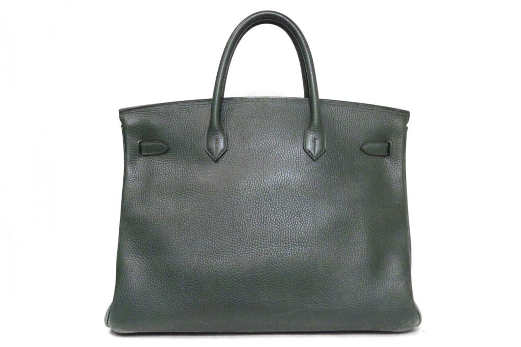 This HERMES Green Togo Leather Birkin Bag is the 40 cm size with golden hardware.  The front clasp is stamped HERMES-PARIS, and on the reverse side of the clasp is the blind stamp 