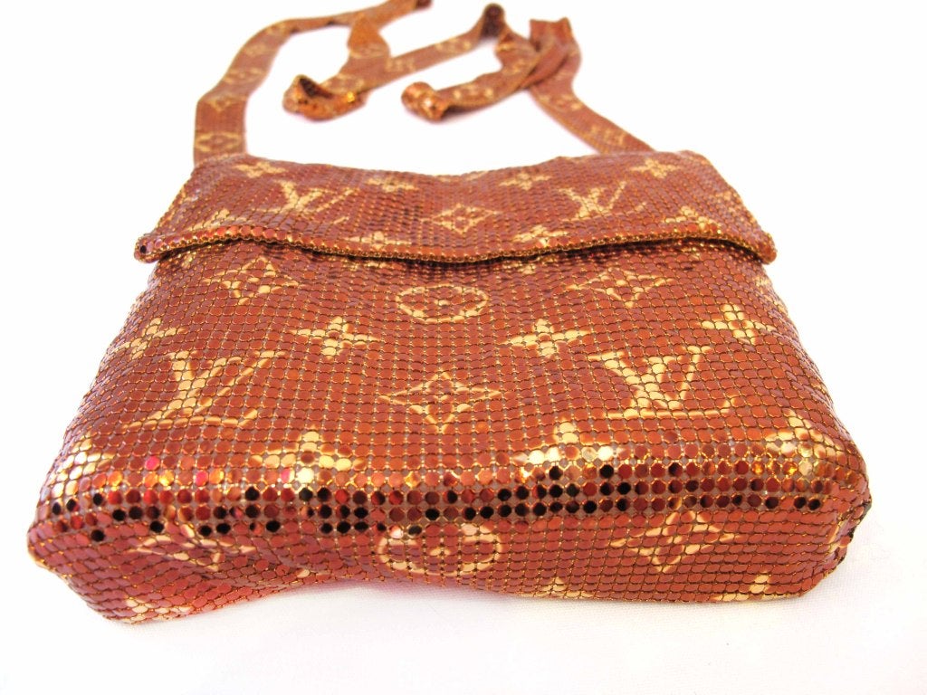 This Louis Vuitton crossbody bag is a very collectible and rare item! The bag is made of meshed metal. Lable inside the bag reads: 