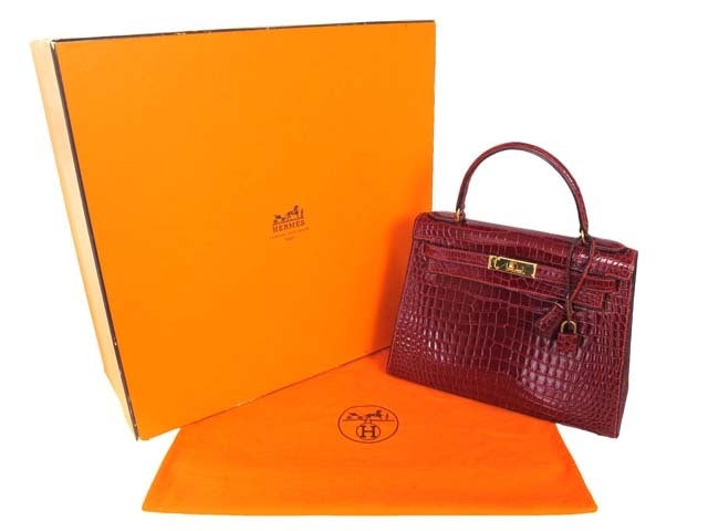 Hermes Porosus Crocodile Leather Red Kelly Bag
Age: 1986
Made In France
Materials: Porosus Crocodile Leather.
Stamped: 