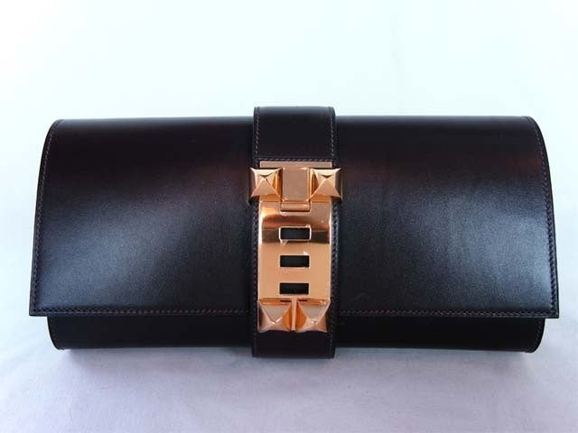 Hermes Brown Leather Medor Celebrity Clutch

Age: 2008
Made In France
Materials: Leather
Blind Stamp Reads Letter: 