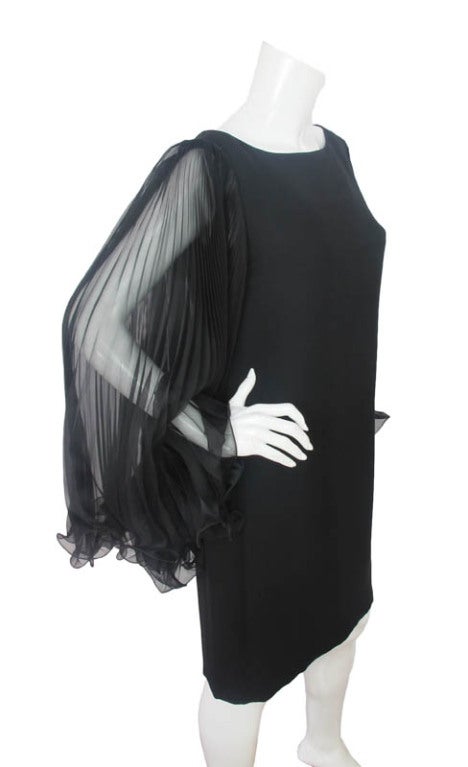 MARCHESA Black Silk Dress With Sheer Sleeves SZ - 12. Made In USA. 100% Silk. Features Pleated sleeves. Closes With Rear Zipper.

Approximate Measurements: 

Shoulder: 16