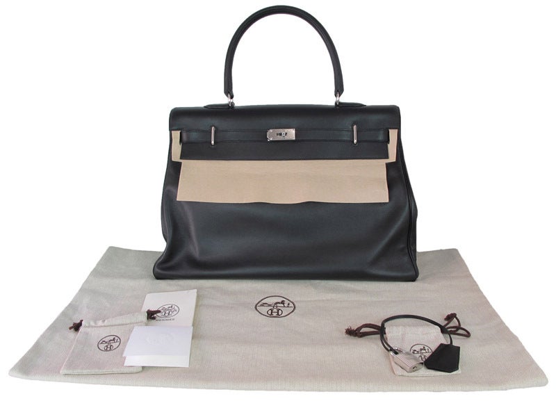 Hermes black swift leather giant travel size 50cm Kelly with palladium hardware
Age: c. 2010
Materials: Swift leather
Blind Stamp Reads 