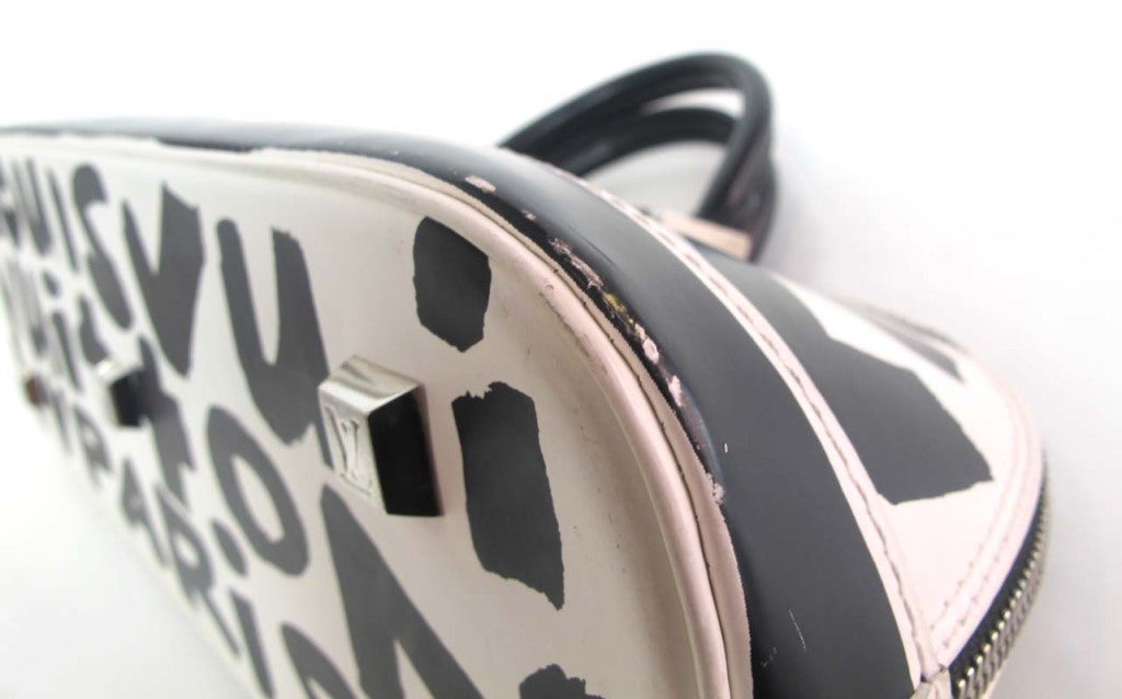 LOUIS VUITTON Black/White Canvas Long "ALMA" Bag at 1stdibs