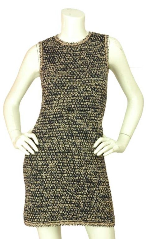 Chanel Navy/White Sleeveless Crochet Dress
Age: 2011
Made In Italy
Composition: 76% Rayon, 24% Polyamide
Features Brown Tweed CC On The Left Side

Measurements: 

Marked Size: 34

Bust: 29
