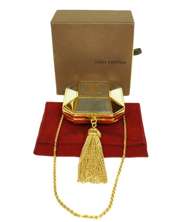Louis Vuitton Minaudière Petit Bijou
Age: 2012
Made In Italy
Leather Lined
Big LV Logo On Front
Chain Tassel
Date Code Reads: 