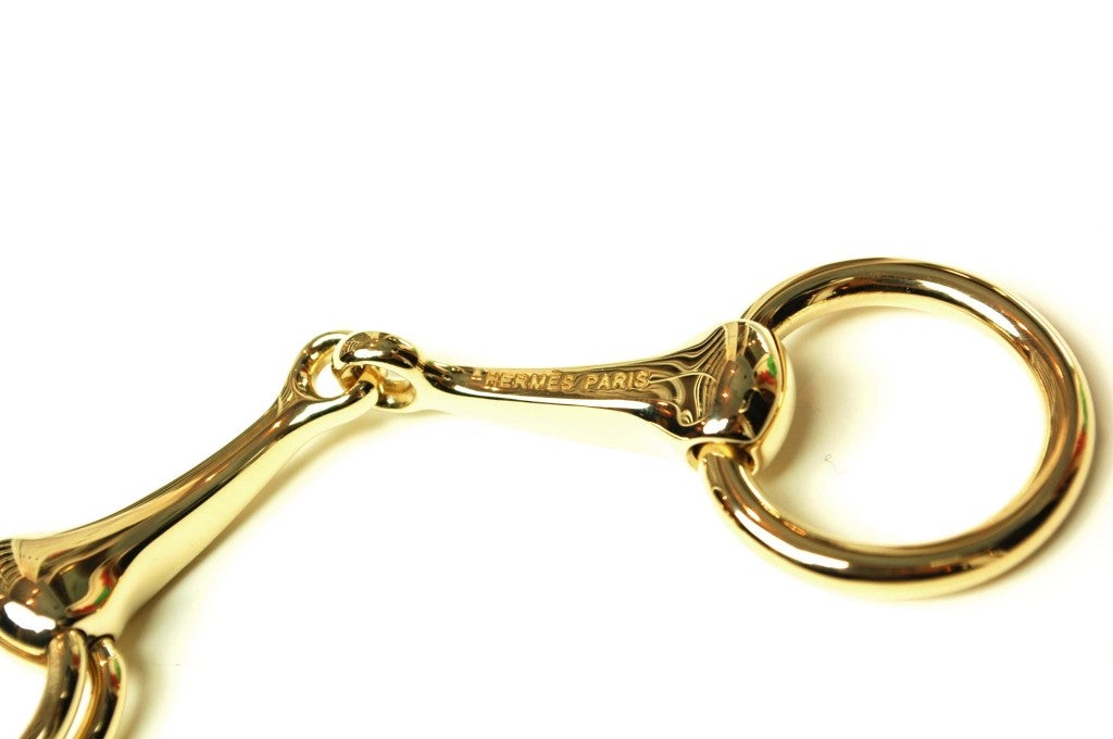 HERMES Gold Horsebit Scarf Ring at 1stDibs hermes horsebit scarf ring, gold scarf ring, horse