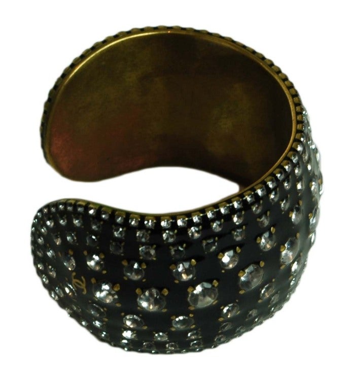 Chanel Black Coated Enamel Cuff with Rhinestones
Age: 1998
Made In France
Materials: Steel, Coated Enamel, Rhinestones
Stamped: 