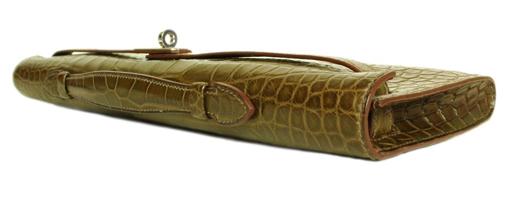 Hermes Kelly Alligator Cut Clutch
Age: 2011

Made in France 

Materials: Alligator

Stamped in Silver: 