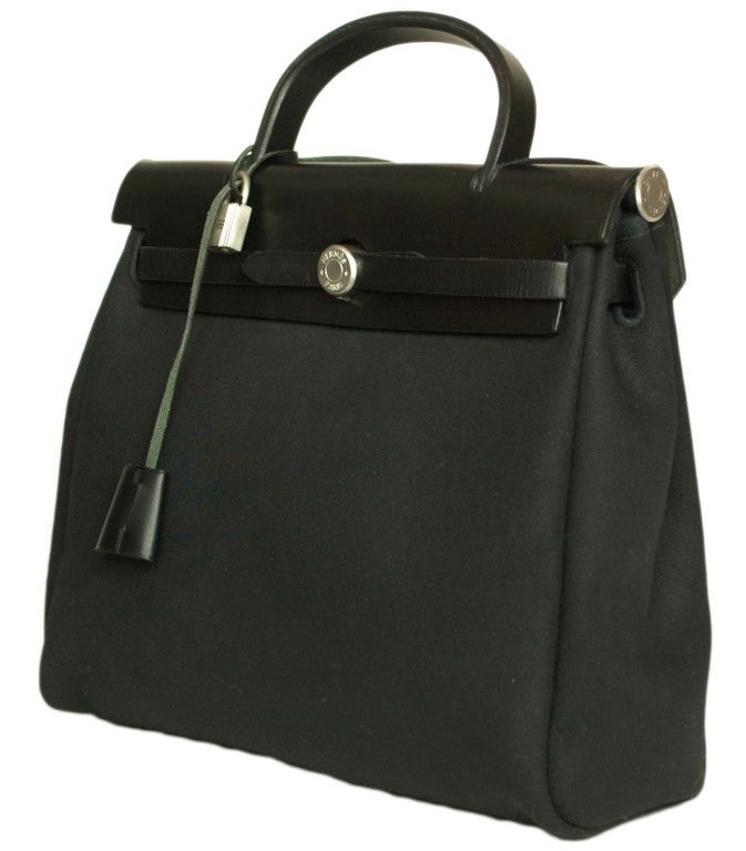 Hermes Canvas/Black 2 In 1 Her Bag
Age: 2001
Made In France
Materials: Canvas and Leather
 Stamped 