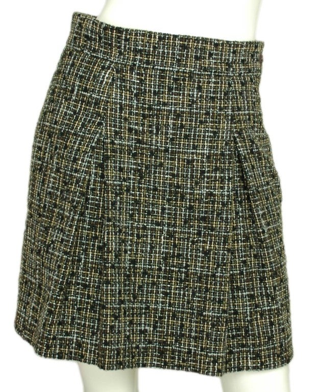 Chanel Black/Grey Tweed Skirt
Age: 2009
Made In France
Composition: 86% Cotton, 13% Rayon, 1% Nylon
Label Reads: 