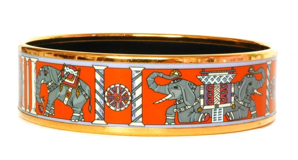 Hermes Orange and Grey Elephant Print Enamel Bangle (Rt. $550.00)
Made In Austria
Materials: Enamel
Stamped: 