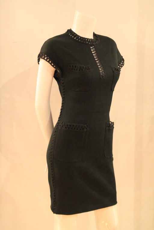 This CHANEL Black Short Sleeve Stretch Dress evokes the timeless and classic design of Chanel.  Made of black ribbed stretch cotton, this dress is sure to turn heads.  <br />
<br />
Two front breast pockets, along with two hip patch pockets accent