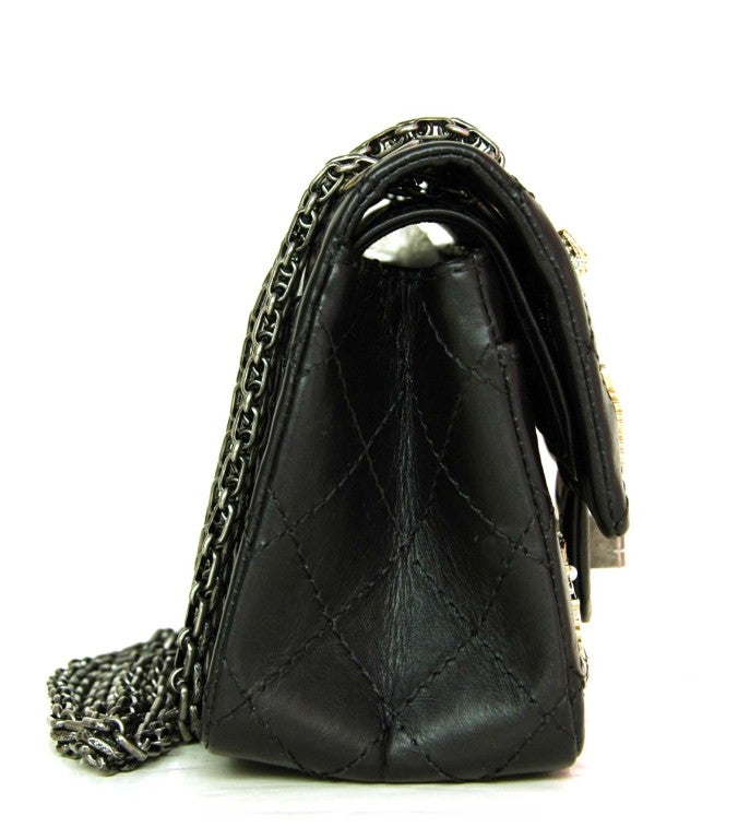 Chanel Black Quilted Lambskin Leather Double Flap Mini Lucky Charm Bag With 2.55 Twist Lock
Age: 2013
Made In France
Materials: Lambskin Leather, Silvertone Hardware
Exterior Slip Pocket
Interior Slip and Pen Pockets
Two Compartments
One
