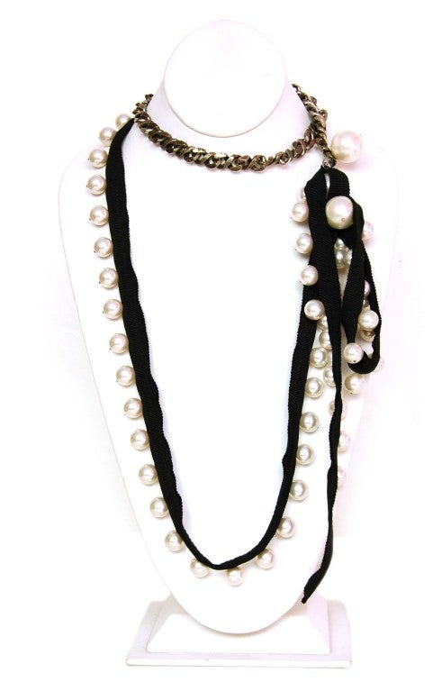 Lanvin Pearl And Chain Necklace
Materials: Metal, Faux Pearls, Ribbon, Rhinestones
Toggle Closure
Stamped: 