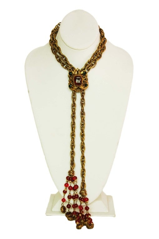 Chanel Vintage Goldtone Necklace With Gripoix Medallion And Tassels
Age: c. 1994
Country of Origin: Unknown
Materials: Goldtone Metal, Gripoix Stones
Hook Closure
Stamped: 
