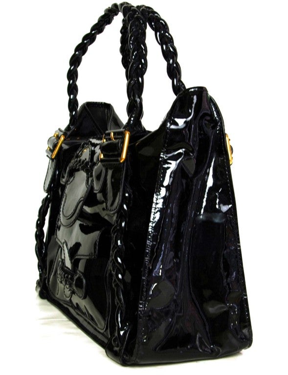 Valentino Black Patent Leather Histoire Bag with Braided Handles
Made In Italy
Materials: Patent Leather
One Zipper Pocket Inside and One Outside Pocket
Stamped: VALENTINO GARAVANI

Comes With:
Dust Bag

Length: 17